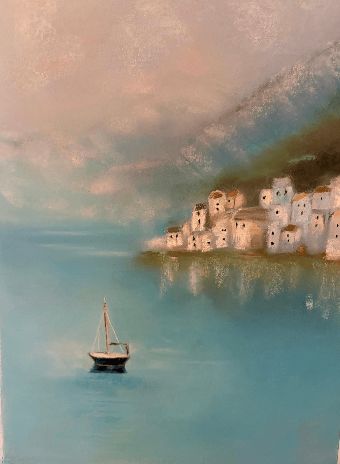 A sailboat in a coastal town