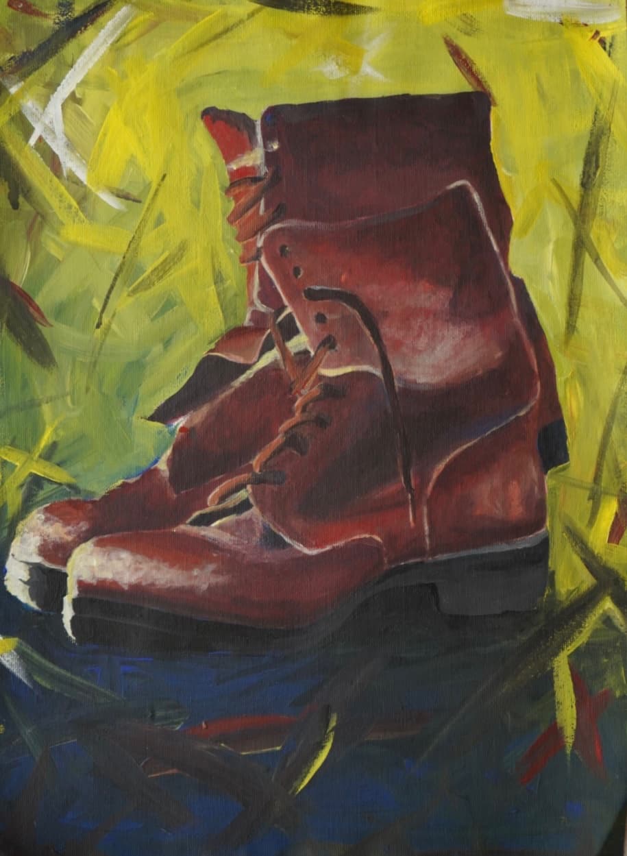 Army boots on a yellow background.