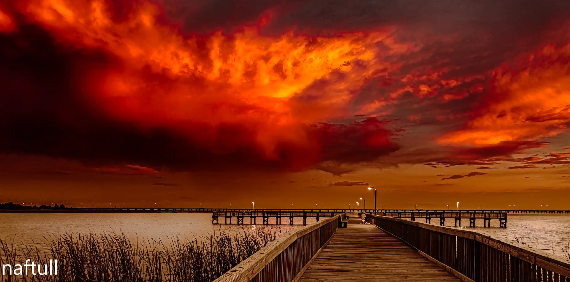 Pier Beneath a Burning Sky in Mobile Alabama